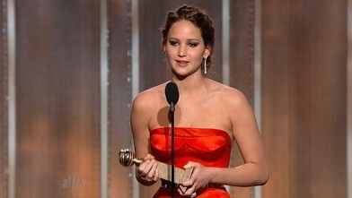 PHOTO: Jennifer Lawrence accepts her Golden Globe award, Jan 11, 2013.
