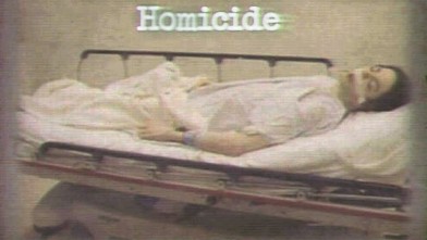 PHOTO: Dr. Conrad Murray's trial started with the District Attorney showing a picture of a dead Michael Jackson lying on a gurney with his mouth open,  eyes closed and  tape over space between his lips and nose.