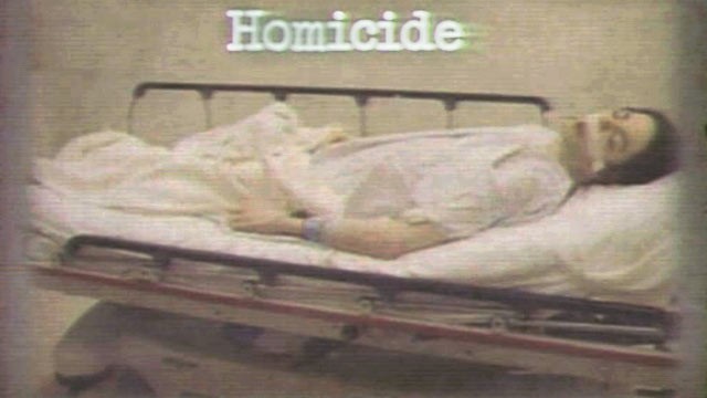 PHOTO: Dr. Conrad Murray's trial started with the District Attorney showing a picture of a dead Michael Jackson lying on a gurney with his mouth open, eyes closed and tape over space between his lips and nose.