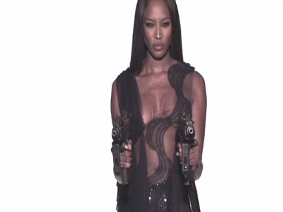 Picture of Naomi Campbell firing machine guns.