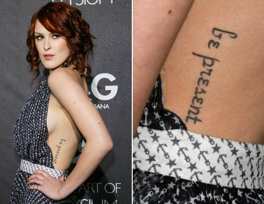 Willis sports a tattoo on her side, which reads "be present.