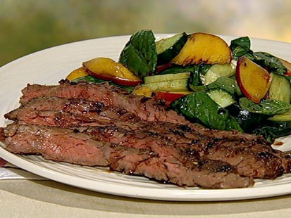Mario Batali's skirt steak with peach cucumber salad is shown here.