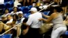 VIDEO: A trio of arguing tennis fans start a fight in the stands.
