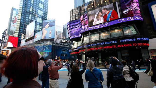 PHOTO: Onlookers watch the live broadcast of The Royal Wedding on ABC News Super Sign in Times Square, April 29, 2011. 4/29/11.