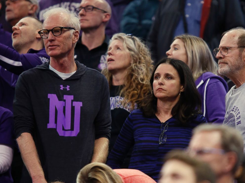 PHOTO: Julia Louis-Dreyfus, lower right, and her husband, producer and writer Brad Hall, left, watch Northwestern play Vanderbilt during a first-round game of the NCAA mens college basketball tournament, March 16, 2017, in Salt Lake City.