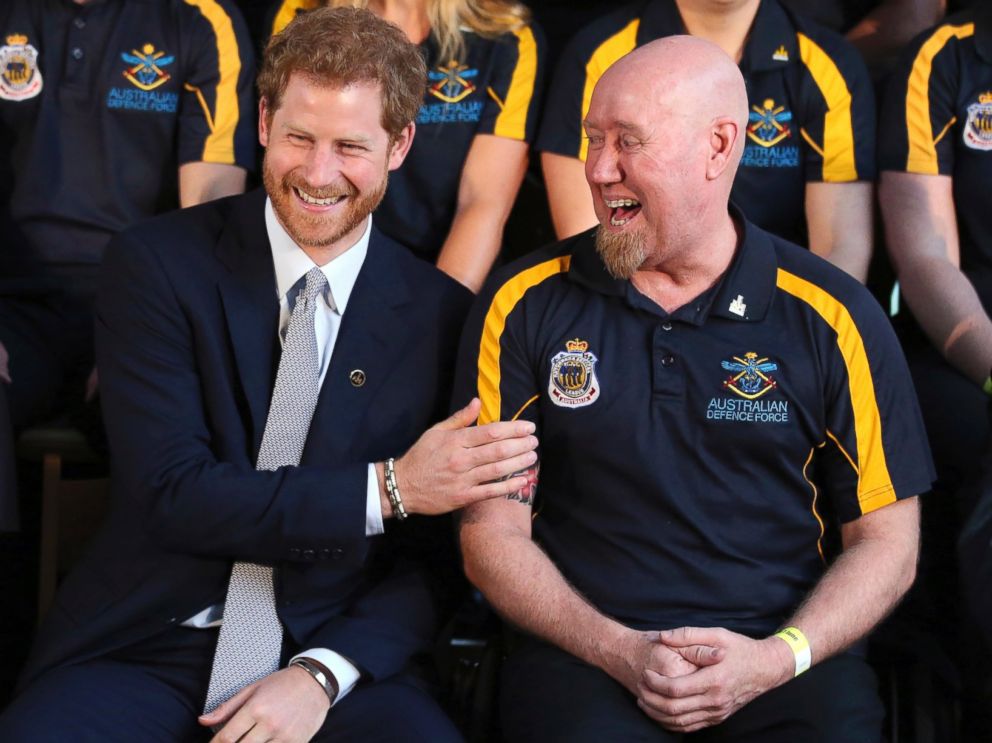 PHOTO: Britains Prince Harry laughs with Jeff Wright during a photo opportunity at a function at Admiralty House in Sydney, June 7, 2017. Prince Harry is in Sydney to launch the 2018 Invictus Games.