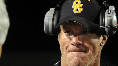 PHOTO: Oak Grove assistant coach Brett Favre, right, celebrates a touchdown with head coach Nevil Barr as the Warriors take on Hattiesburg during a high school football game on Sept. 20, 2013, in Hattiesburg Miss.