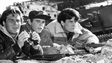 PHOTO: After hiding in the mountains for a month, Jed (Patrick Swayze, left), Robert (C. Thomas Howell, center) and Matt (Charlie Sheen, right) secretly observe enemy movements before venturing back into their occupied hometown in Red Dawn, 1987.