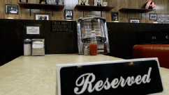 PHOTO: A reserved sign sits on the booth where the last show of the HBO series 