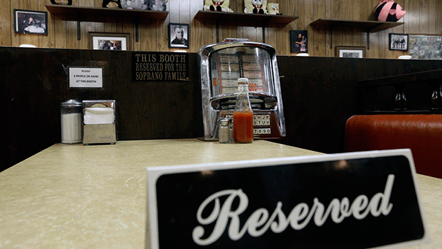 PHOTO: A reserved sign sits on the booth where the last show of the HBO series "The Sopranos" was filmed at Holstens ice cream parlor, June 19, 2013, in Bloomfield, N.J.