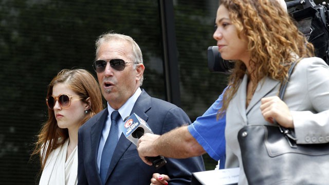 PHOTO: Actor Kevin Costner, center, leaves Federal Court for a lunch break in New Orleans, June 4, 2012.