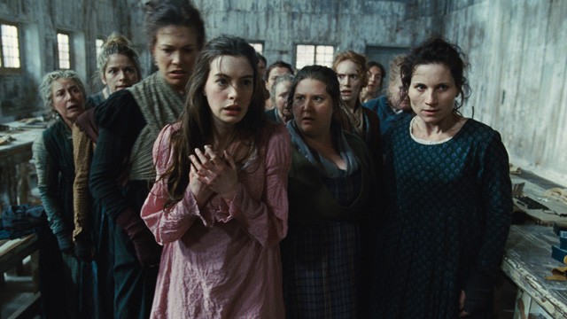 PHOTO: This undated publicity photo provided by Universal Pictures shows Anne Hathaway, left, as Fantine, being thrown out of the factory in a scene from director, Tom Hoopers new film, "Les Misérables," the motion-picture adaptation of the beloved globa