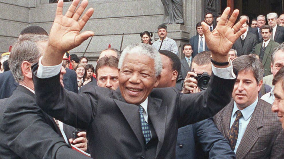PHOTO: In this July 23, 1998 file photo, South African President Nelson Mandela greets a crowd outside the National Congress building in Buenos Aires, Argentina.