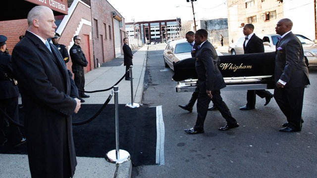 PHOTO: A coffin holding the remains of singer Whitney Houston is carried into the New Hope Baptist Church before funeral services for the singer in Newark, N.J. on Feb. 18, 2012.
