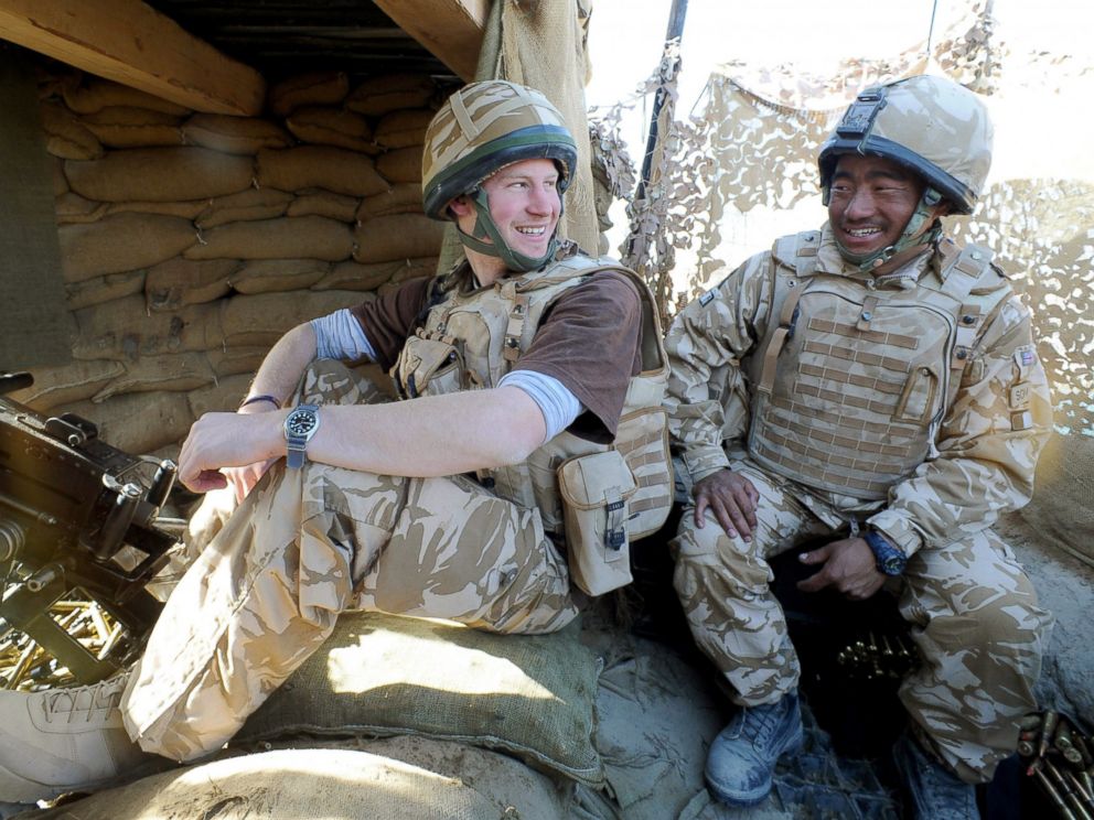 PHOTO: Prince Harry talks to a Gurkha soldier after firing a 50mm machine gun at Taliban fighters from the observation post in Helmand province, Southern Afghanistan, Jan. 2, 2008.