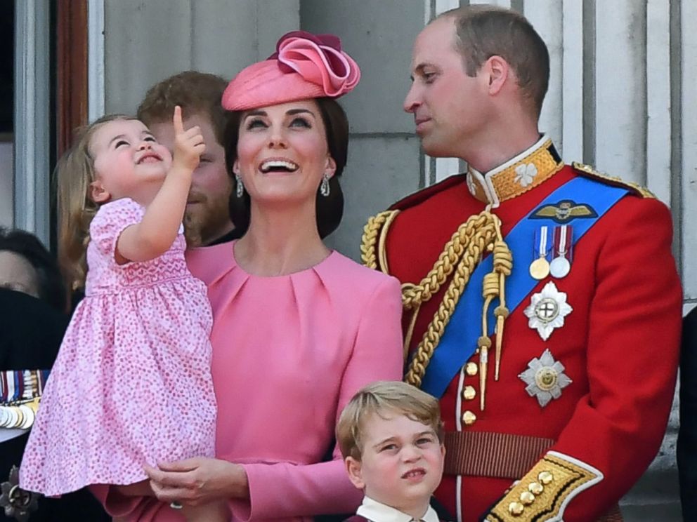 PHOTO: Prince William and Duchess Catherine, with their children, Princess Charlotte and Prince George, watch a fly-past of aircraft by the Royal Air Force, during the Trooping the Colour in London, June 17, 2017.