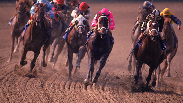 PHOTO: Jockey Steve Cauthen rides on Affirmed who takes the lead against jockey Jorge Velasquez and Alydar to win the Triple Crown in Belmont, New York in this June 10, 1978 file photo.