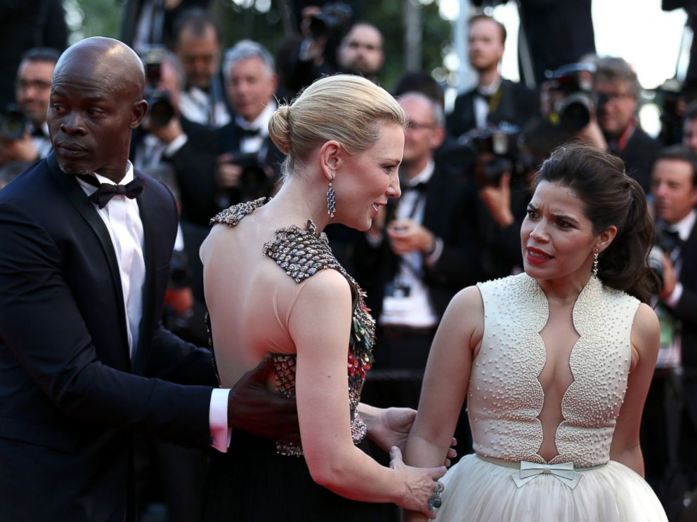 PHOTO: America Ferrera reacts after a man attempted to climb under her dress on the red carpet at the How To Train Your Dragon 2 premiere during the Cannes Film Festival on May 16, 2014 in Cannes, France.
