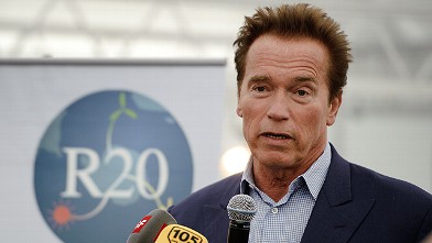 PHOTO: Former Governor of California, Arnold Schwarzenegger, delivers a speech on March 8, 2012 in Geneva.