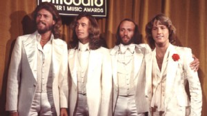 PHOTO: The Bee Gees are seen here featuring all brothers, Barry Gibb, Robin Gibb, Maurice Gibb and Andy Gibb at the Billboard Music Awards, Los Angeles, California, 1977.