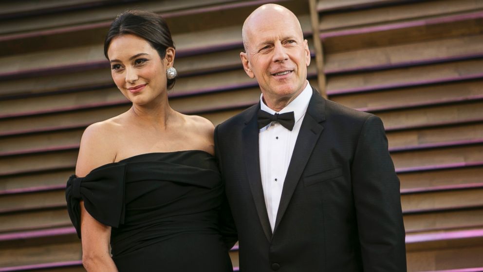 PHOTO: Bruce Willis and his wife Emma Heming arrive at the 2014 Vanity Fair Oscar Party on March 2, 2014 in West Hollywood, California.