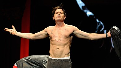 PHOTO: Charlie Sheen speaks on stage during his "Violent Torpedo of Truth/Defeat Is Not An Option" tour at Radio City Music Hall on April 10, 2011 in New York City.