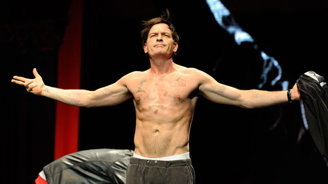 PHOTO: Charlie Sheen speaks on stage during his "Violent Torpedo of Truth/Defeat Is Not An Option" tour at Radio City Music Hall on April 10, 2011 in New York City.