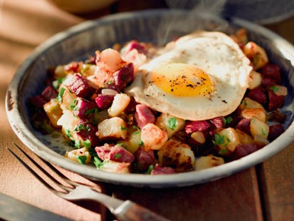 Emeril's braised cabbage with corned beef hash is shown here.