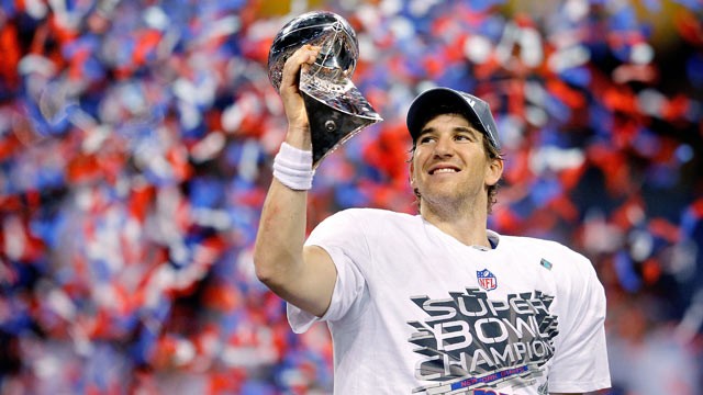 PHOTO: Quarterback Eli Manning poses with the Vince Lombardi Trophy after the Giants defeated the Patriots by a score of 21-17 in Super Bowl XLVI at Lucas Oil Stadium, Feb. 5, 2012 in Indianapolis, Ind.