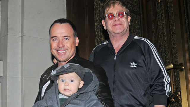 PHOTO: David Furnish and Elton John with their son Zachary leaving their hotel, October 27, 2011 in New York City.
