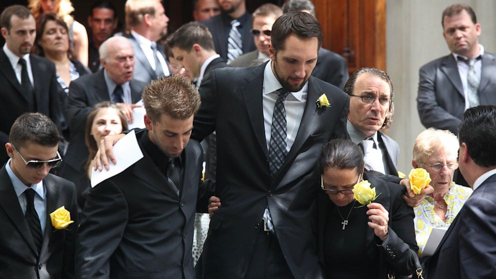 PHOTO: Boyfriend, Ryan Anderson, and the mother of former "Bachelor" contestant, Gia Allemand, attend the funeral for Gia Allemand at Trinity Grace Church on Aug. 22, 2013 in New York City.