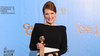 PHOTO: Julianne Moore poses with her Best performance by an actress in a mini-series or motion picture made for television award for "Game Change" in the press room at the Golden Globes awards ceremony in Beverly Hills, January 13, 2013.
