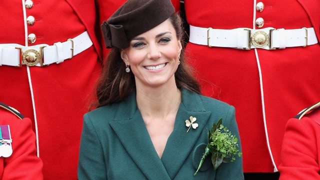 PHOTO: Catherine, the Duchess of Cambridge poses for an official photograph flanked by members of the Irish guards as she visits Aldershot Barracks on St Patrick's Day in Aldershot on March 17, 2012.