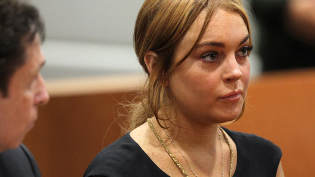 PHOTO: Lindsay Lohan appears in court for a pretrial hearing with her lawyer Mark Heller at the Airport Branch Courthouse of Los Angeles Superior Court, Jan. 30, 2013 in Los Angeles.