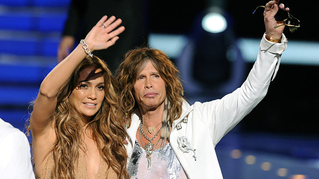 PHOTO: Judges Jennifer Lopez and Steven Tyler walk onstage during Fox's "American Idol 2011" finale results show.