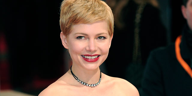 PHOTO: Michelle Williams poses on the red carpet arriving at the BAFTA British Academy Film Awards at the Royal Opera House in London on Feb. 12, 2012.