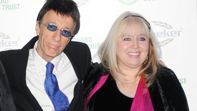 PHOTO: Robin Gibb and wife Dwina Gibb arrive at the Celebration of the Bee Gees evening in aid of The Outward Bound Trust at Battersea Evolution on Jan. 12, 2009 in London, England.