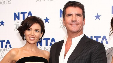 PHOTO: Simon Cowell is shown with Dannii Minogue at The O2 Arena, Jan. 20, 2010 in London, England.