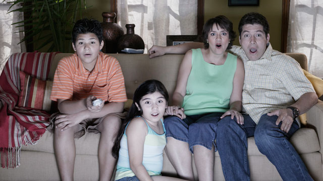 PHOTO: Watching television with family can lead to awkward situations.