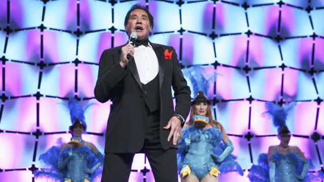 PHOTO: Wayne Newton performs the theme song to "Phineas and Ferb" at Disneys presentation to licensees and retailers at the Licensing International Expo 2010 in Las Vegas.