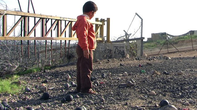 PHOTO: Emad Burnat began filming the constructions of fences and Israeli settlements when his son Gibreel was born in 1995.