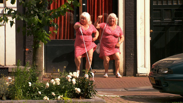 PHOTO: Louise and Martine Fokkens are two of Amsterdams beloved prostitutes and they happen to be twins with 40+ years of experience.