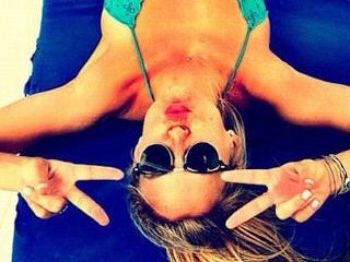 Photos: Bar Refaeli Relaxes in Green Bikini