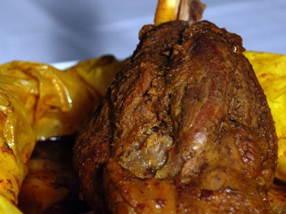 PHOTO: Jonathan Waxmans braised lamb shanks with dates, tangerines and baby onions are shown here.
