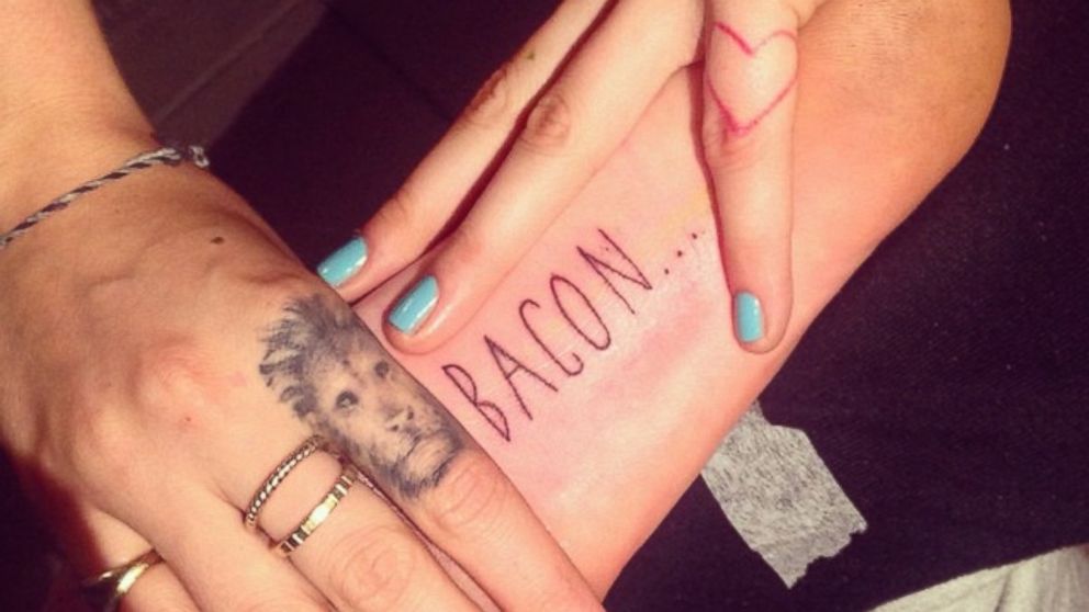 9. Cara Delevingne's "Bacon" finger tattoo - wide 3