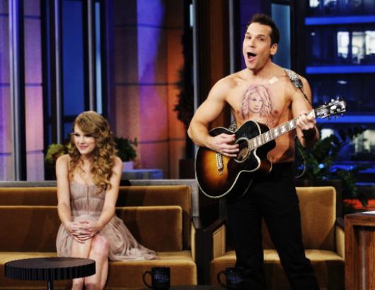 Cook had a fake tattoo of Swift's face on his chest. (Paul Drinkwater/NBC)