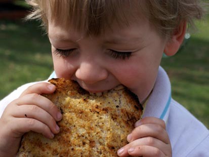 PHOTO: Erin Chases son is shown here eating grilled garlic bread.