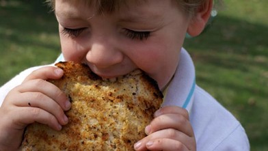 PHOTO: Erin Chase's son is shown here eating grilled garlic bread.