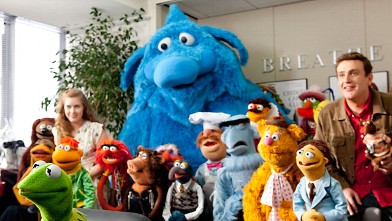 PHOTO: Kermit the Frog is joined by Gary (Jason Segel), Mary (Amy Adams) and a multitudinous mass of Muppets as they try to convince a TV exec to put their save-the-theater telethon on the air in "The Muppets.