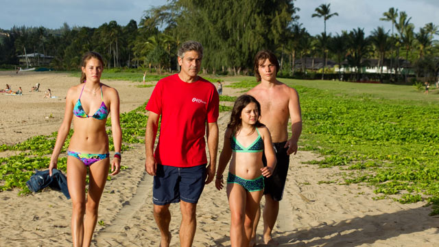 PHOTO: A land baron tries to re-connect with his two daughters after his wife suffers a boating accident in The Descendants.